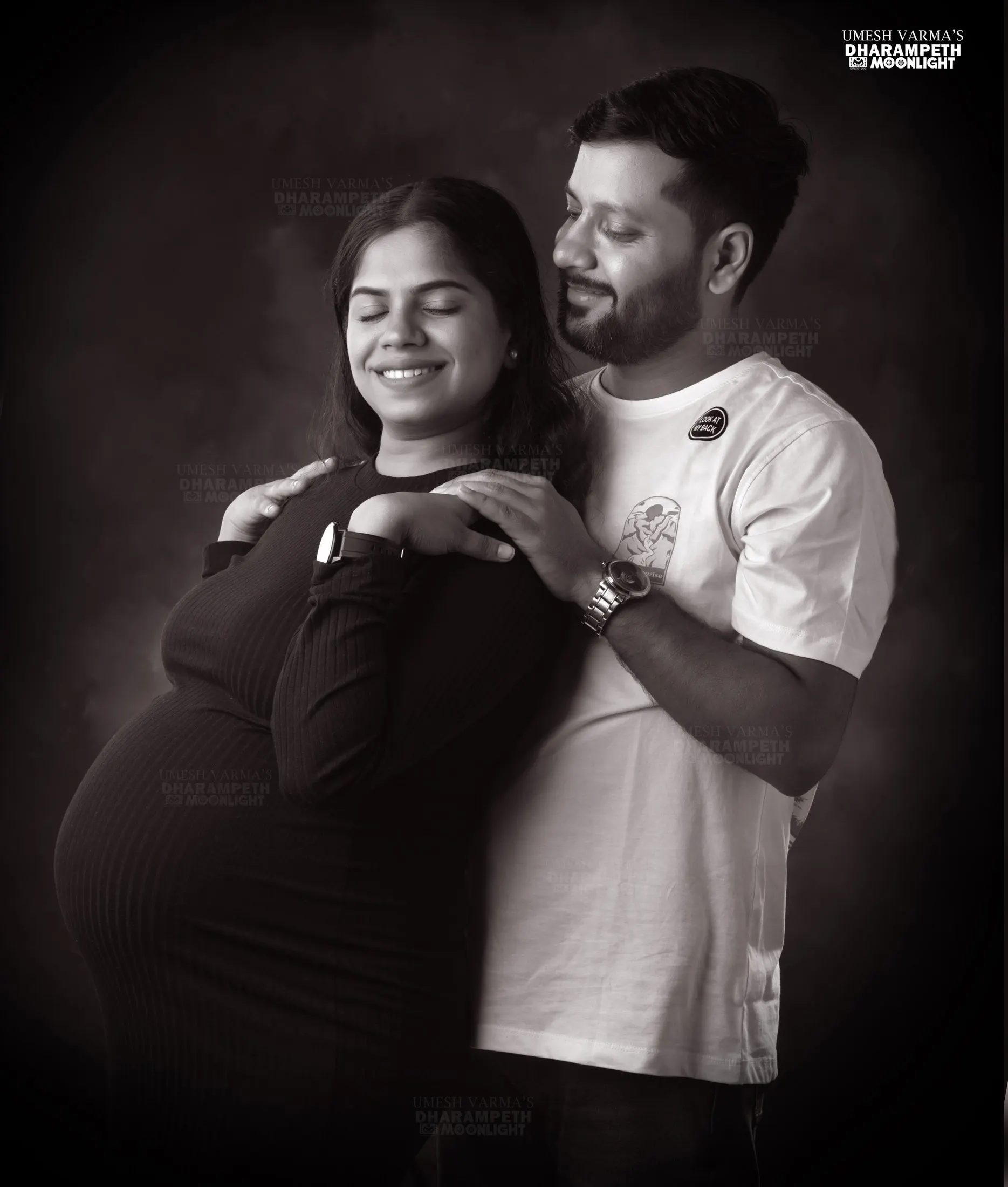 Maternity portrait of an expecting couple in monochrome tones